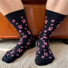 Load image into Gallery viewer, A picture of a man's legs wearing black socks with pink ribbons